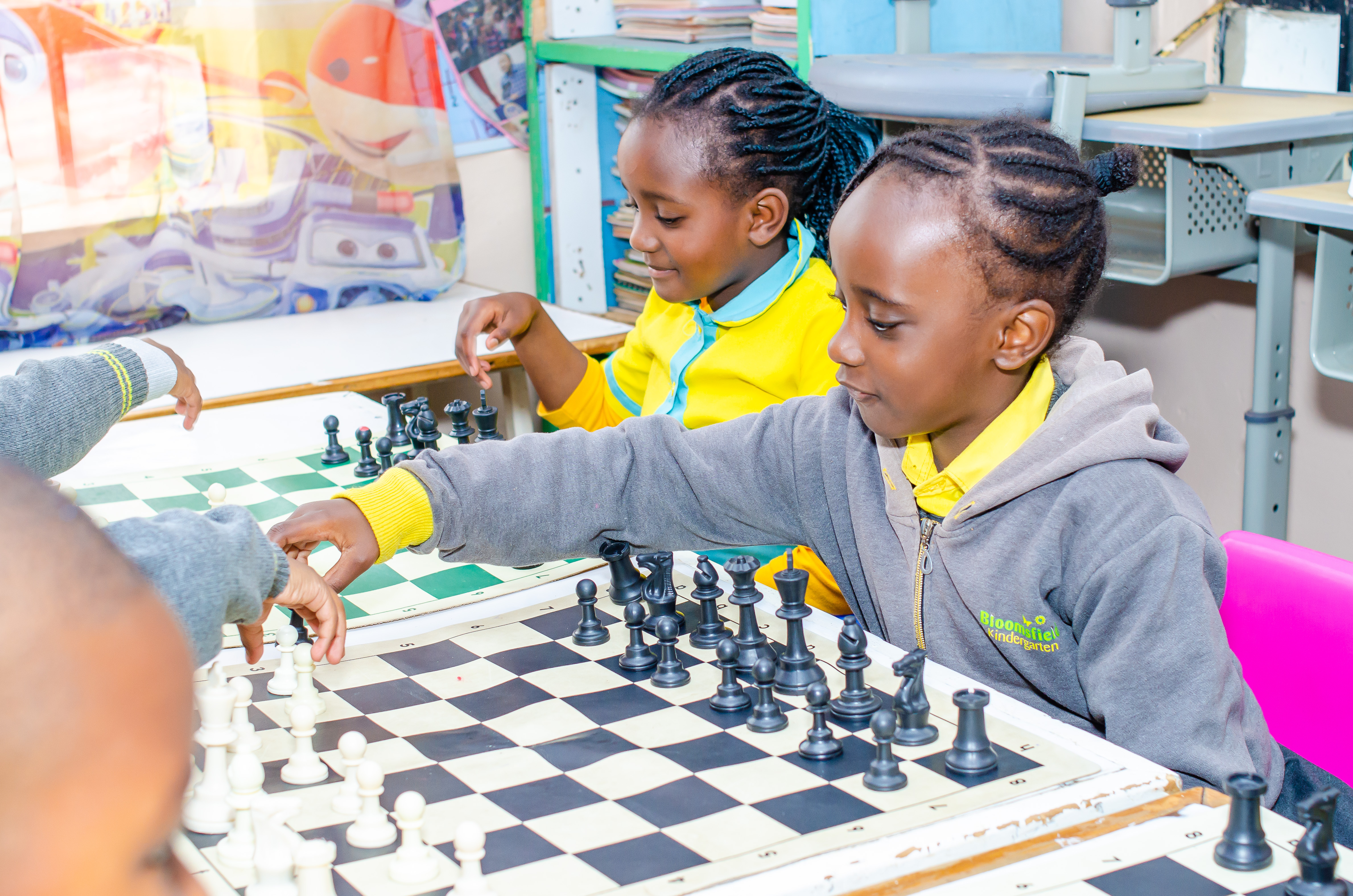 Children gardening outdoors with teachers